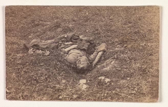 Confederate Soldier on the Battlefield at Antietam September 1862 Alexander Gardner American, Scottish The Battle of Antietam (named after a creek near Sharpsburg, Maryland) occurred on September 17, 1862, and was known as the bloodiest single day of the war. More than 26,000 soldiers on both sides were wounded or killed, including this Confederate soldier, who, according to the caption added by the Mathew Brady studio, after being wounded, had dragged himself to a little ravine on the hillside, where he died. It is generally agreed that Brady and his photographers, who at this time still included Alexander Gardner, repositioned some of the recently dead at Gettysburg, and one may question the ultimate, artful arrangement of this Conf Copyright: xpiemagsx Metbot-116781