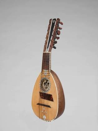 Mandolin 18th century Christian Nonnemacker Known as a mandola o mandolino alla Genovese, this mandoline has six pairs of gut strings, fifteen rosewood ribs, and mother-of-pearl and tortoiseshell inlays. It differs from other gut-strung mandolins in being tuned an octave higher than the modern guitar (e, a, d™, g™ b-natural, e) and having a guitar-like peg block.. Mandolin. Italian. 18th century. Wood, various materials. Italy. Chordophone-Lute-plucked-fretted Copyright: xpiemagsx Metbot-142852
