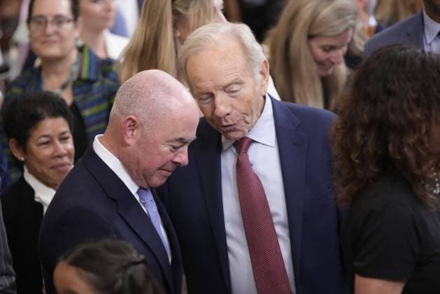 July 7, 2022, Washington, District of Columbia, USA: United States Secretary of Homeland Security Alejandro Mayorkas, left, and former US Senator Joseph Lieberman (Democrat of Connecticut) confer departs after US President Joe Biden presented the Medal of Freedom to seventeen recipients during a ceremony in the East Room of the White House in Washington, DC on Thursday, July 7, 2022 Washington USA - ZUMAs152 20220707_zaa_s152_075 Copyright: xChrisxKleponisx