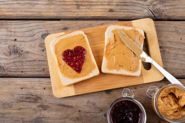 Close-up of open face peanut butter and jelly sandwich on serving board with jars at table Close-up of open face peanut butter and jelly sandwich on serving board with jars at table. unaltered, peanut butter and jelly sandwich, healthy food, table knife, preparation and breakfast., model released, , property released, Cape Town, South Africa, , 3117126.jpg, close,open,face,peanut butter,jelly,sandwich,serving,board,jar,table knife,unaltered,healthy food,knife,preparation,breakfast,kitchen,meal,cooking,bread,lunch,food,snack,delicious,tasty,drink,gourmet,dinner,portrait,cook,table,cuisine,homemade,cafe,coffee,ingredient,peanut,butter,healthy