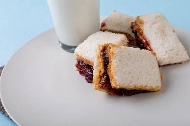 Close-up of peanut butter and jelly sandwich slices served with milk glass in plate on table Close-up of peanut butter and jelly sandwich slices served with milk glass in plate on table. unaltered, peanut butter and jelly sandwich, healthy food and breakfast., model released, , property released, Cape Town, South Africa, , 3117161.jpg, close,peanut butter,jelly,sandwich,slice,served,milk,glass,plate,table,unaltered,healthy food,breakfast,delicious,meal,drink,food,tasty,snack,gourmet,lunch,beverage,dinner,dessert,dish,restaurant,cuisine,fresh,cup,diet,sweet,coffee,nutrition,peanut,butter,healthy