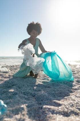 African american woman picking up garbage and collecting in plastic bag at beach against clear sky African american woman picking up garbage and collecting in plastic bag at beach against clear sky. unaltered, responsibility and environmental issues concept., model released, , property released, Cape Town, South Africa, , 3137142.jpg, people,african american,woman,picking,garbage,collecting,plastic bag,beach,clear,sky,unaltered,responsibility,environmental,issue,concept,trash,sea,rubbish,ocean,waste,landscape,coast,blue,travel,recycling,water,vacation,recycle,sand,summer,nature,tourism,view,sun,ecology,african,american,plastic,bag Young Adult,Woman,Female,Black