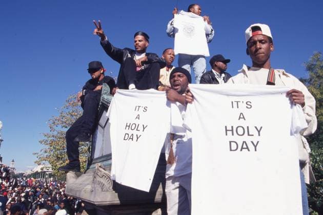 October 16, 1995 Washington DC: Men outside US Capitol building during Million Man March holding Its a Holy Day shirts. Louis Farrakhan, the leader (from 1978) of the Nation of Islam (NOI), an African American movement that combined elements of Islam with Black nationalism, organized and led the million Man March to the capitol in Washington D.C. Washington U.S.  - ZUMAm62_ 19951016_jtc_m62_491 Copyright: xKevinxMcKiernanx
