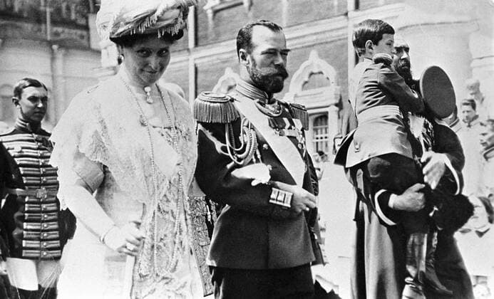 NICHOLAS II EMPRESS CROWN PRINCE 24358 25.05.1913 Emperor Nicholas II, center, Empress Alexandra, left, and Crown Prince Alexis, right, carried by a Cossack attendant, during a Kremlin gala in honor of the 300th Romanov dynasty establishment anniversary, 1913. RIA Novosti Sputnik Moscow Russia  Copyright: xRIAxNovostix