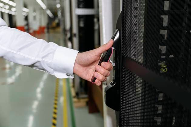 Hands of businessman opening door of data server model released, Symbolfoto property released, EYAF01943