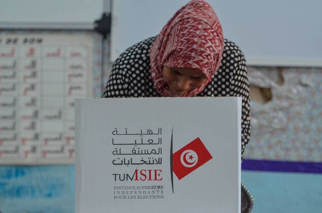 July 25, 2022, Tunis, Tunisia: Tunis, Tunisia. 25 July 2022. Tunisians cast their votes at a polling station in Tunis for the referendum on the new draft constitution in Tunisia. Tunisians have begun voting on the new constitution at 6 a.m. local time on Monday, with results expected to be made known early on Tuesday Tunis Tunisia - ZUMAd99_ 20220725_zap_d99_003 Copyright: xHasanxMradx