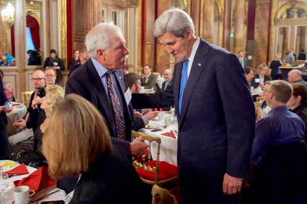 U.S. Secretary of State John Kerry greets businessman and environmental activist Ted Turner on December 8, 2015, at the Westin Hotel in Paris, France, before addressing a United Nations Foundation breakfast focused on the ocean amid the COP21 climate change summit. Copyright: xpiemagsx deptofstpie23052022-13431 !ACHTUNG AUFNAHMEDATUM GESCHÄTZT!