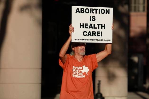 Abortion Rights Protest At Federal Courthouse In Texas A sign reads, Abortion is health care! outside the federal courthouse in Houston, Texas on July 27th, 2022. Houston United States  Copyright: xReginaldxMathalonex originalFilename: mathalone-notitle220727_npO74.jpg