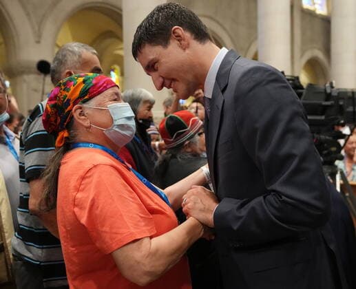 July 28, 2022, Ste-Anne-de-Beaupro PQ, CANADA: Prime Minister Justin Trudeau greets a member of the Indigenous community as he arrives for mass by Pope Francis at the Basilica of Sainte-Anne-de-BeauprÃ in Ste-Anne-de-BeauprÃ , Que., Thursday, July 28, 2022. Ste-Anne-de-Beaupré CANADA  - ZUMAc35_ 20220728_zaf_c35_013 Copyright: xNathanxDenettex