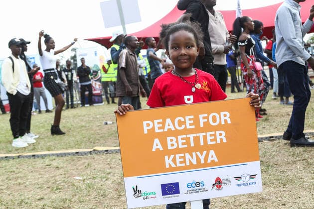 July 30, 2022, Nakuru, Rift Valley, Kenya: Young Fiorella Kiingati holds a placard saying Peace for a better Kenya during a peace concert held to reach peace and harmony ahead of Kenya s August General Election. Kenyans will be going to the polls to choose their preferred president and members of both the national and county assemblies. Nakuru Kenya - ZUMAs197 20220730_zaa_s197_034 Copyright: xJamesxWakibiax