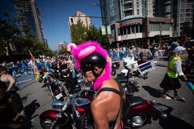 July 31, 2022, VANCOUVER, BC, CANADA: A person sports a flamingo on their helmet while waiting for Dykes on Bikes to lead the start of the Vancouver Pride Parade, in Vancouver, on Sunday, July 31, 2022. VANCOUVER CANADA  - ZUMAc35_ 20220731_zaf_c35_051 Copyright: xDarrylxDyckx