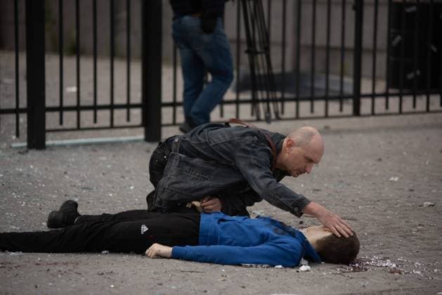 July 20, 2022, Kharkiv, Ukraine: DMYTRO KUBATA, 13-year-old boy senselessly killed as Putin s thugs shelled a bus stop in Eastern Ukraine, near a mosque in a non-military area. Teenager s grief-stricken father VYACHESLAV KUBATA, kneeling beside his body and holding his hand, guarding his body. Dmytro was at bus stop with his sister Ksenia, 15, when Russian missiles struck in Ukraine s second-biggest city, Kharkiv on Wednesday. Now in hospital seriously wounded and fighting for her life, while Dmytro died from his injuries at the scene. Their bereft father Vyacheslav knelt for two hours by his son s body, reading him prayers. Kharkiv Ukraine - ZUMAqp1_ 20220720_zip_qp1_006 Copyright: xHectorxAdolfoxQuintanarxPerezx