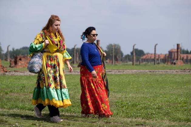 March 11, 2000, Brzezinka, Poland: Two Gypsie girls walk along the path at the former camp Auschwitz II Birkenau. Roma and Sinti Genocide Remembrance Day. 78 years ago, on the night of 2 to 3 August 1944, the Germans liquidated the camp for Gypsies (Zigeunerfamilienlager) in KL Auschwitz II Birkenau. The anniversary was organised at the former camp Auschwitz II-Birkenau. Brzezinka Poland - ZUMAs197 20000311_zaa_s197_003 Copyright: xWojciechxGrabowskix