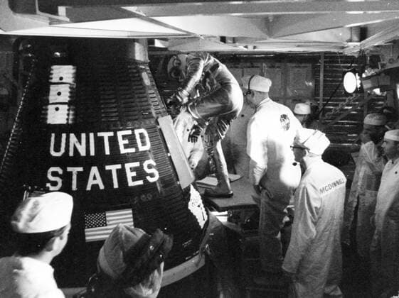S63-06259 (14 May 1963) --- Astronaut L. Gordon Cooper Jr., prime pilot for the Mercury-Atlas 9 (MA-9) mission, is assisted into his Faith 7 Mercury spacecraft early morning on May 14, 1963. Cooper remained in the spacecraft for approximately five hours and then climbed out again as the mission was delayed because of trouble at a tracking station. Copyright: xpiemagsx piemagsspace-1065 !ACHTUNG AUFNAHMEDATUM GESCHÄTZT!