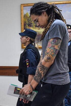 MOSCOW REGION, RUSSIA - AUGUST 4, 2022: US Olympic basketball champion Brittney Griner (R) is escorted for the verdict announcement at the Khimki Municipal Court in the town of Khimki, northeast of Moscow. Griner has been found guilty of smuggling and possession of drugs and sentenced to nine years in prison. Mikhail Voskresensky POOL TASS  TS13CFC7