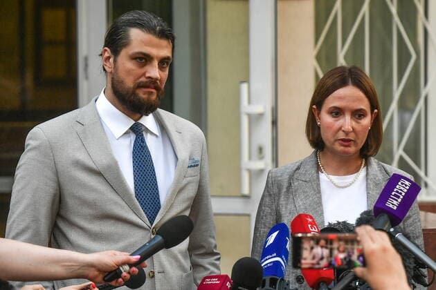 MOSCOW REGION, RUSSIA - AUGUST 4, 2022: Lawyers Alexander Boikov (L) and Maria Blagovolina give comments to the media after the verdict announcement to US Olympic basketball champion Brittney Griner at the Khimki Municipal Court in the town of Khimki, northeast of Moscow. Griner has been found guilty of smuggling and possession of drugs and sentenced to nine years in prison. Mikhail Voskresensky POOL TASS  TS13CFC8