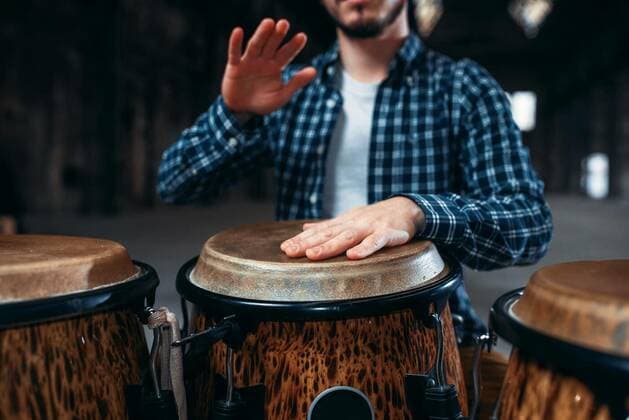  Drummer hands playing on wooden drum, closeup, Drummer hands playing on wooden drum, closeup. Bongo, musical percussion instrument, ethnic music model released, Symbolfoto , 05.02.2020 05:44:43, Copyright: xNomadSoulx Panthermedia28062195.jpg