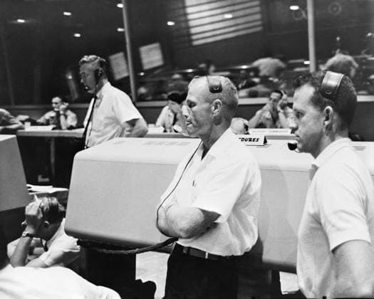 S61-03829 (21 July 1961) --- View of the Mission Control Center at Cape Canaveral during the Mercury-Redstone 4 (MR-4) mission. Astronauts John Glenn (left) and L. Gordon Cooper (right) act as spacecraft communicators (CAPCOM). Copyright: xpiemagsx piemagsspace-54391 !ACHTUNG AUFNAHMEDATUM GESCHÄTZT!