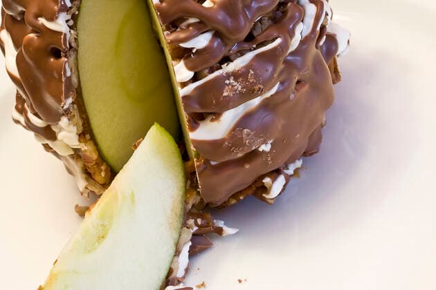 apple dipped in chocolate both white and dark, much like a carmel apple but better Copyright: BobxGubbins 30239028