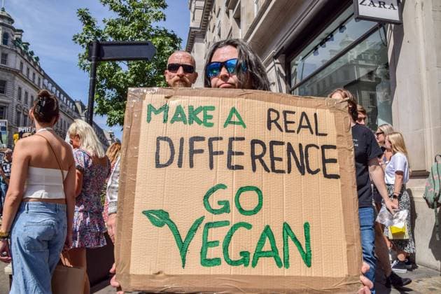 August 6, 2022, London, United Kingdom: A protester holds a pro-vegan placard during the demonstration in Regent Street. Thousands of people marched through central London in support of animal rights and veganism, and called for an end to speciesism and all forms of animal exploitation. London United Kingdom - ZUMAs197 20220806_zaa_s197_220 Copyright: xVukxValcicx
