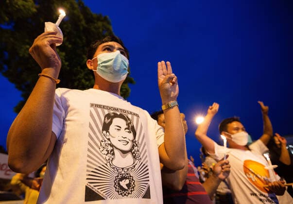 August 8, 2022, Chiang Mai, Thailand: Activists hold candles and raise three finger salutes during the anniversary of the 8888 Uprising at Tha Phae Gate in Chiang Mai. On the 8th August Myanmar commemorated the 34th anniversary of the 8888 Uprising , also known as the People Power Uprising, which peaked on August 8, 1988, was a series of nationwide demonstrations, marches and protests that began as a student movement in Yangon. Chiang Mai Thailand - ZUMAs197 20220808_zaa_s197_179 Copyright: xPongmanatxTasirix
