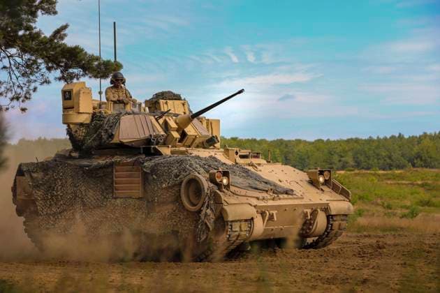 July 13, 2022 - Drawsko Pomorskie, Poland - Spc. Kenneth Black, assigned to Chaos Company, 1st Battalion, 68th Armor Regiment, 3rd Armored Brigade Combat Team, 4th Infantry Division, directs a M2A3 Bradley Fighting Vehicle into position to recover a squad as they conclude a squad live-fire exercise at Drawsko Pomorskie, Poland, July 13, 2022. The 3rd Armored Brigade Combat Team, 4th Infantry Division, is among other units assigned to the 1st Infantry Division, proudly working alongside NATO allies and regional security partners to provide combat-credible forces to V Corps, America s forward-deployed corps in Europe. Drawsko Pomorskie Poland - ZUMAz03_ 20220713_stw_z03_426 Copyright: xU.S.xArmyx