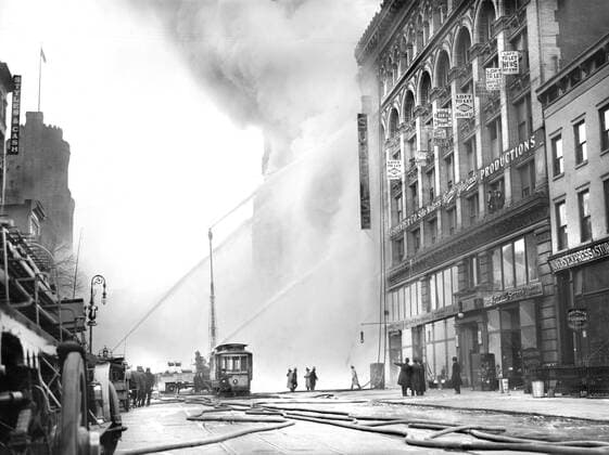 Fireman spraying water on burning building, 14th Street, New York City, New York, USA, Bain News Service, December 1909  Copyright: xCircaxImagesx ghi-circa11153