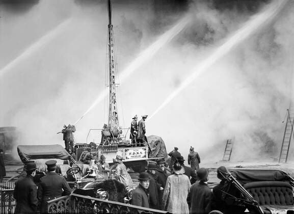 Fireman spraying water on burning building, 14th Street, New York City, New York, USA, Bain News Service, December 1909  Copyright: xCircaxImagesx ghi-circa11154