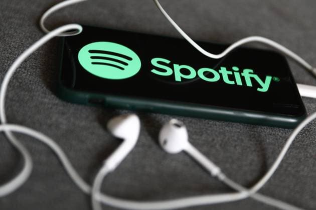 Music And Audiobook Subscription Services Photo Illustrations Spotify logo displayed on a phone and headphones are seen in this illustration photo taken in Krakow, Poland on August 22, 2022. Krakow Poland  Copyright: xJakubxPorzyckix originalFilename: porzycki-musicand220822_nprFC.jpg