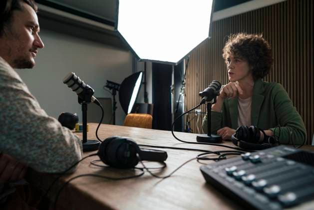 Presenter talking with guest in radio station model released, Symbolfoto property released, JOSEF11205