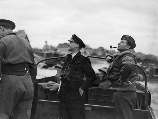 The Royal Navy during the Second World War Watching Allied planes go over while they were touring the Normandy beaches in a DUKW or duck are Admiral Sir Bertram Ramsay (left) Allied Naval Commander, Expeditionary Forces flying his flag in the destroyer KELVIN and Air Chief Marshal Sir Arthur Tedder, Deputy Supreme Commander, Expeditionary Forces. Whilst there they met Rear Admiral Sir Philip Vian and Rear Admiral A G Talbot. Copyright: xpiemagsx admiralww2pie10322-2855 !ACHTUNG AUFNAHMEDATUM GESCHÄTZT!
