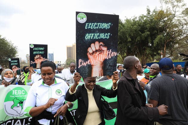 August 25, 2022, Nairobi, Kenya: Independent Electoral and Boundaries Commission (IEBC) election officials and civil society activists march while holding placards as they call for protection. They also demanded justice for returning officer Daniel Musyoka, who was found dead on Monday, August 15, 2022 in Oloitoktok, Kajiado County. Nairobi Kenya - ZUMAs197 20220825_zaa_s197_075 Copyright: xJohnxOchiengx