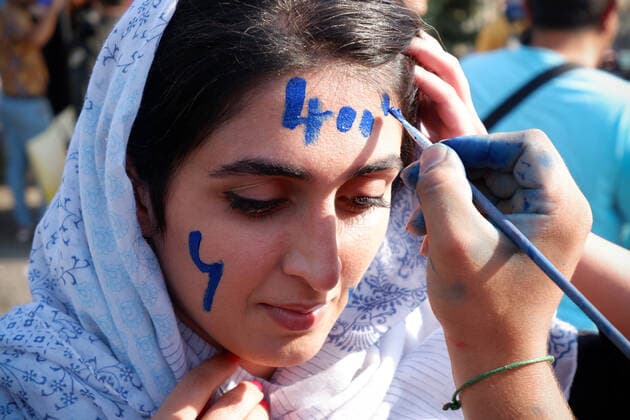 August 25, 2022, Tehran, Tehran, Iran: Female soccer fans prepare to attend a match between their team Esteghlal and Mes-e Kerman in Iran s Premier League at Azadi stadium in Tehran, Iran, Aug. 25, 2022. A limited number of Iranian women have been allowed into a stadium in Tehran to watch a league football match for the first time. Tehran Iran - ZUMAi98_ 20220825_zih_i98_048 Copyright: xRouzbehxFouladix