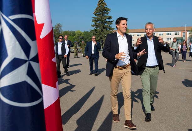 August 26, 2022, COLD LAKE, AB, CANADA: Prime Minister Justin Trudeau, left, and NATO Secretary General Jens Stoltenberg speak together after leaving a press conference at 4 Wing Cold Lake air base in Cold Lake Alta, on Friday August 26, 2022. COLD LAKE CANADA  - ZUMAc35_ 20220826_zaf_c35_023 Copyright: xJasonxFransonx
