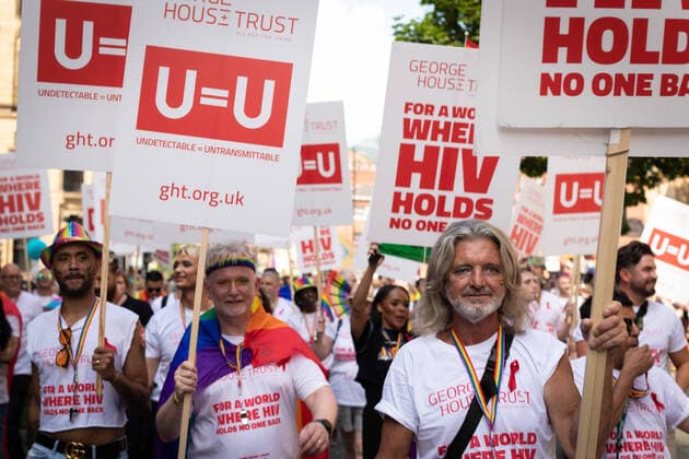 August 27, 2022, Manchester, United Kingdom: George House Trust members march to raise awareness about HIV during the Pride Parade. This year sees the parade come back in full capacity for the first time since 2019. Manchester United Kingdom - ZUMAs197 20220827_zab_s197_006 Copyright: xAndyxBartonx
