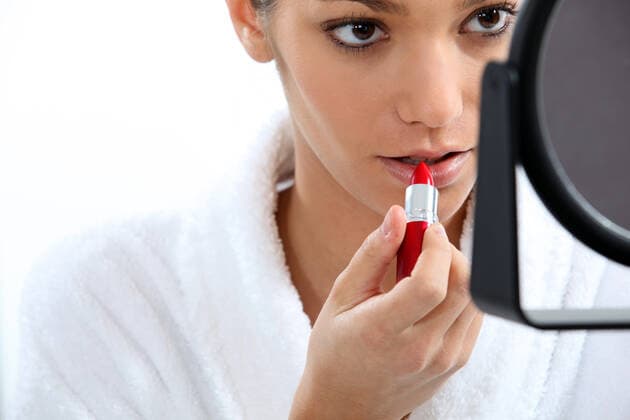 Woman applying lipstick in front of mirror, model released, , 4295173.jpg, 20s, anti-aging, appearance, applying, background, bathroom, beauty, conceal, conceitedness, concentrating, cosmetics, cream, dressing gown, e, elegance, fashion, front view, getting ready, hair, landscape, lips, lipstick, make-up, mirror, moisturizer, morning, mouth, narcissism, ponytail, preparing, pride, products, red, robe, routine, skin, style, tied-up, vain, vanity, white,