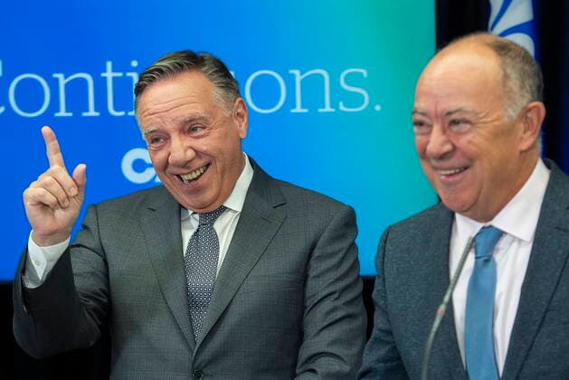 September 3, 2022, Montreal, PQ, Canada: Coalition Avenir Quebec outgoing health minister Christian Dube, right, looks on as CAQ Leader Francois Legault reacts to a reporteröÄÃ s question during a news conference while on an election campaign stop in Montreal, Saturday, Sept. 3, 2022. Quebecers will go to the polls on October 3rd. Montreal Canada  - ZUMAc35_ 20220903_zaf_c35_004 Copyright: xGrahamxHughesx