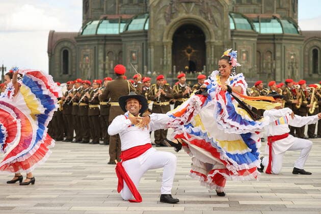 MOSCOW REGION, RUSSIA - SEPTEMBER 3, 2022: Venezuelan dancers take part in a performance as part of the 15th Spasskaya Tower International Military Music Festival by the Main Cathedral of the Russian Armed Forces in Kubinka. Mikhail Tereshchenko TASS  TS1405D6