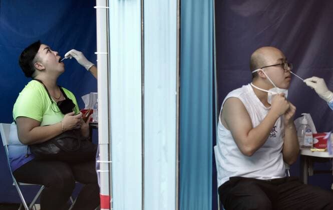 September 5, 2022, HONG KONG, CHINA: Male and female citizens receiving mouth and nose swabbing inside the booth at Covid-19 Community Testing Centre in Hong Kong. The surging coronavirus outbreak in Hong Kong has reached new cases in the 5 digit numbers daily. HONG KONG CHINA - ZUMAl137 20220905_zap_l137_007 Copyright: xLiauxChung-renx