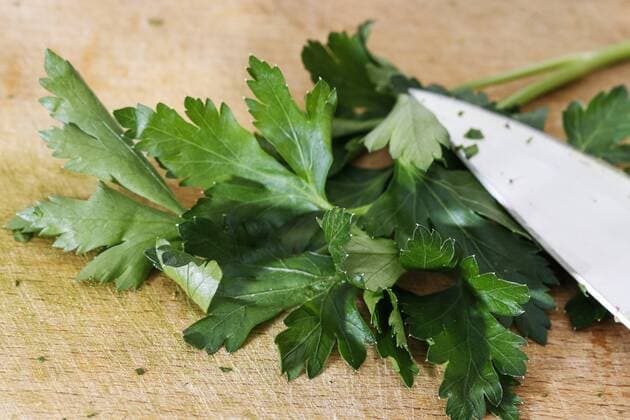 Fresh parsley and knife on wooden board. Cooking time  BEW1DE515B5