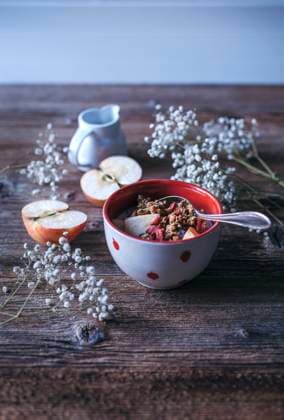 Granola with apples, goji berries and oat milk served in a bowl Granola with apples and oat milk served in a bowl Copyright: xLilixBasicxCapaccettixPhotographyx LBC070417-9
