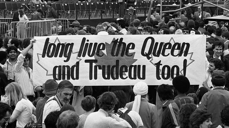 April 17, 1982, OTTAWA, ON, Canada: Onlookers raise a banner wishing long life for Queen Elizabeth II and then-Prime Minister Pierre Trudeau on Parliament Hill after the signing of Canada s constitutional patriation, granting Canada full independence from the United Kingdom, in Ottawa, April 17, 1982. OTTAWA Canada  - ZUMAc35_ 19820417_zaf_c35_006 Copyright: xRyanxRemiorzx