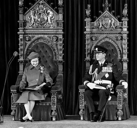 April 17, 1982, OTTAWA, ON, Canada: Queen Elizabeth II looks at her program while seated next to Prince Philip on thrones in the Senate Chamber on Parliament Hill, in Ottawa, April 17, 1982. The Royal Couple took part in proclaiming Canada s independence from the United Kingdom. OTTAWA Canada  - ZUMAc35_ 19820417_zaf_c35_008 Copyright: xRonxPolingx