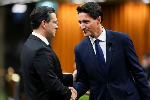September 15, 2022, Ottawa, ON, CAN: Prime Minister Justin Trudeau and Conservative leader Pierre Poilievre greet each other as they gather in the House of Commons on Parliament Hill to pay tribute to Queen Elizabeth in Ottawa on Thursday, Sept. 15, 2022. Ottawa CAN  - ZUMAc35_ 20220915_zaf_c35_001 Copyright: xSeanxKilpatrickx