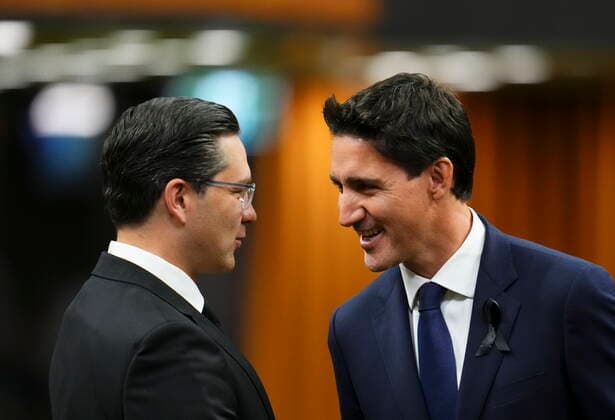 September 15, 2022, Ottawa, ON, CAN: Prime Minister Justin Trudeau and Conservative leader Pierre Poilievre greet each other as they gather in the House of Commons on Parliament Hill to pay tribute to Queen Elizabeth in Ottawa on Thursday, Sept. 15, 2022. Ottawa CAN  - ZUMAc35_ 20220915_zaf_c35_004 Copyright: xSeanxKilpatrickx