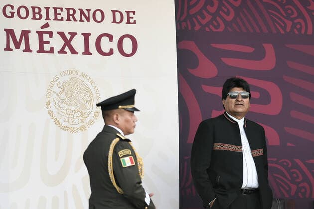 (220917) -- MEXICO CITY, Sept. 17, 2022 -- Former Bolivian President Evo Morales (R) reacts during the military parade for Mexico s Independence Day at the Zocalo Square in Mexico City, Mexico, on Sept. 16, 2022. Mexico on Friday celebrated the 212nd anniversary of its struggle for independence from Spanish colonial rule with a call for world peace and several commemorative activities. ) MEXICO-MEXICO CITY-INDEPENDENCE DAY-MILITARY PARADE XinxYuewei 