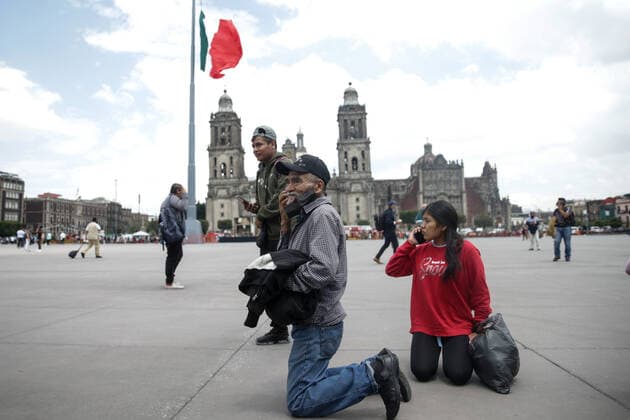 (220919) -- MEXICO CITY, Sept. 19, 2022 -- People make calls after hearing an earthquake alarm in the Zocalo Square in Mexico City, Mexico, on Sept. 19, 2022. An earthquake with a magnitude of 7.4 shook Mexico on Monday, according to preliminary data, with further details unavailable at the moment. ) MEXICO-MEXICO CITY-EARTHQUAKE FranciscoxCanedo 
