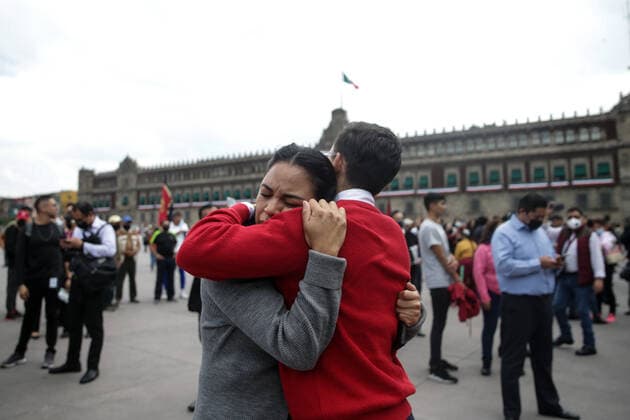 (220919) -- MEXICO CITY, Sept. 19, 2022 -- A couple hugs each other after hearing an earthquake alarm in Mexico City, Mexico, on Sept. 19, 2022. An earthquake with a magnitude of 7.4 shook Mexico on Monday, according to preliminary data, with further details unavailable at the moment. ) MEXICO-MEXICO CITY-EARTHQUAKE FranciscoxCanedo 