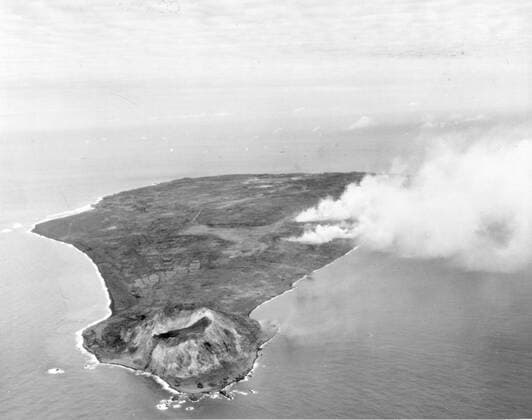 RECORD DATE NOT STATED Smoke Cloud on day 2 of naval and air bombardment on Iwo Jima, Volcano Island. Altitude 2000 . Taken by a plane from the USS MAKIN ISLAND, looking North. 17-Feb 1945. U.S. Navy. 1063_05_Smoke_Cloud_on_Iwo_Jima_-_D-2