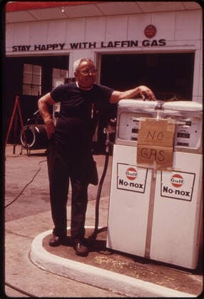 RECORD DATE NOT STATED Gas station operator stands by empty gas pump during the height of the gas shortage, no location, 1973. 1063_05_Gas_Station_Operator_Stands_by_Empty_Pumps